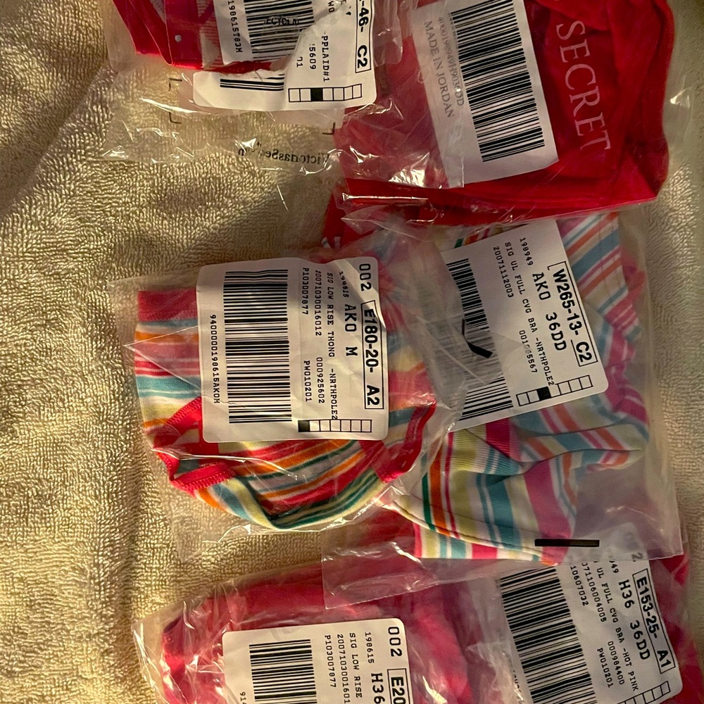 3 Bras 36DD & 3 pairs matching low rise thongs size medium. Sold all together.